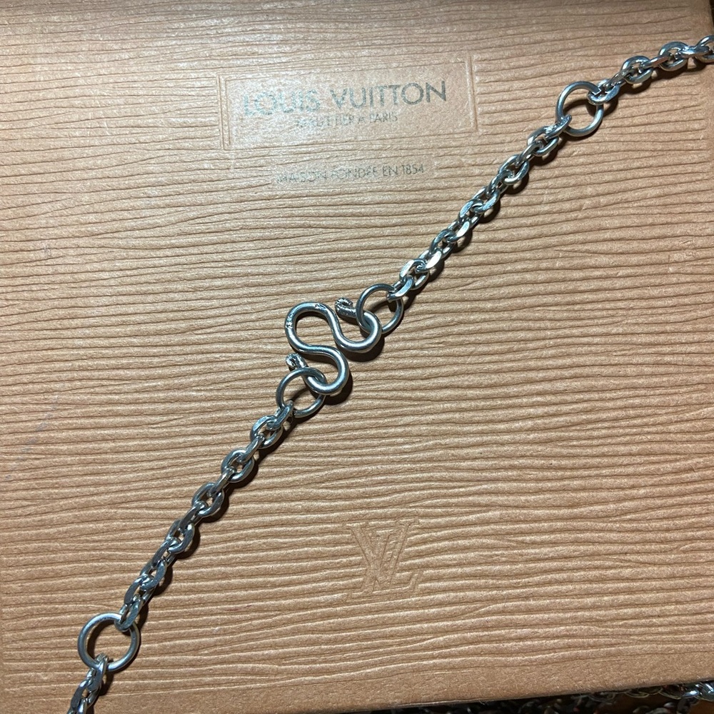 28” silver toned #9 necklace